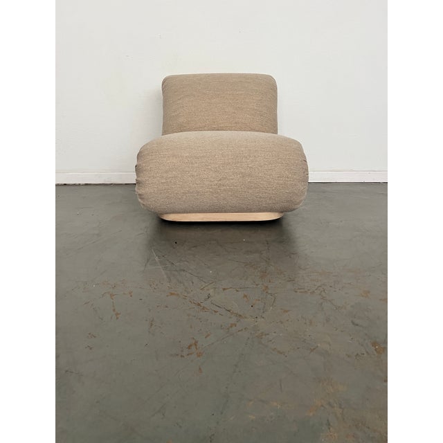 A true showstopper – and on a swivel. Inspired by European vintage seating, this billowy rounded chair features tight...