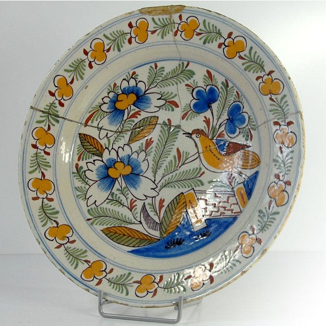 A unique, large, and highly decorative plate. Made of hand-painted faience, it comes from the Dutch Delft factory from the...