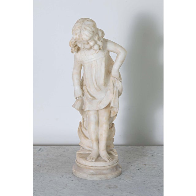 This exquisite alabaster sculpture of a young girl, an Italian creation from the second half of the 19th century (circa...