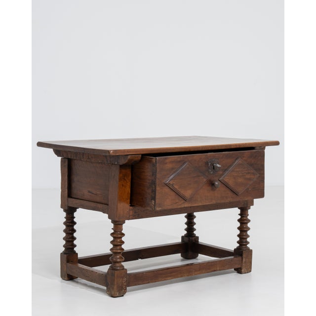 Bearing the robust craftsmanship and dignified simplicity characteristic of the Spanish Colonial tradition, this circa...