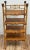 Vintage four-tier shelf made of bamboo with a rich burnt tortoise shell finish. Capped with unique carved wood knobs....