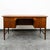 Danish executive desk constructed of beautifully grained walnut wood. This desk has 6 locking drawers, solid brass...