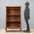 Open walnut bookcase crafted in Italy in the first half of the 20th century. Featuring an elegant structure, it has a...