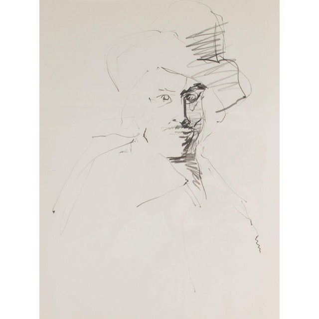 A graphite portrait drawing by the American artist James L. Bruch (1942-2023). This portrait depicts man wearing a hat and...