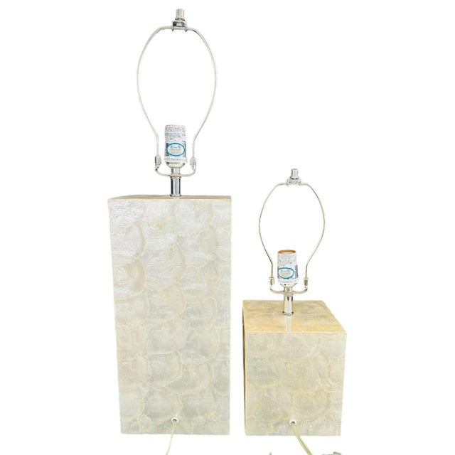 Illuminate your space with this captivating pair of vintage West Elm table lamps from the early 2000s. The bases are...