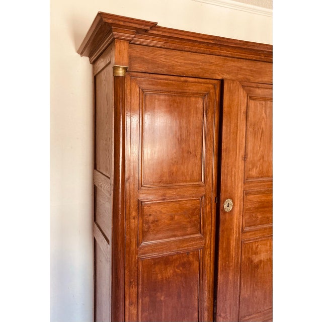 Wood Antique French Empire Armoire Walnut, Columns to Either Side Front With Bronze Gilt Mounts Also Gilt Bronze Key Hole For Sale - Image 7 of 12