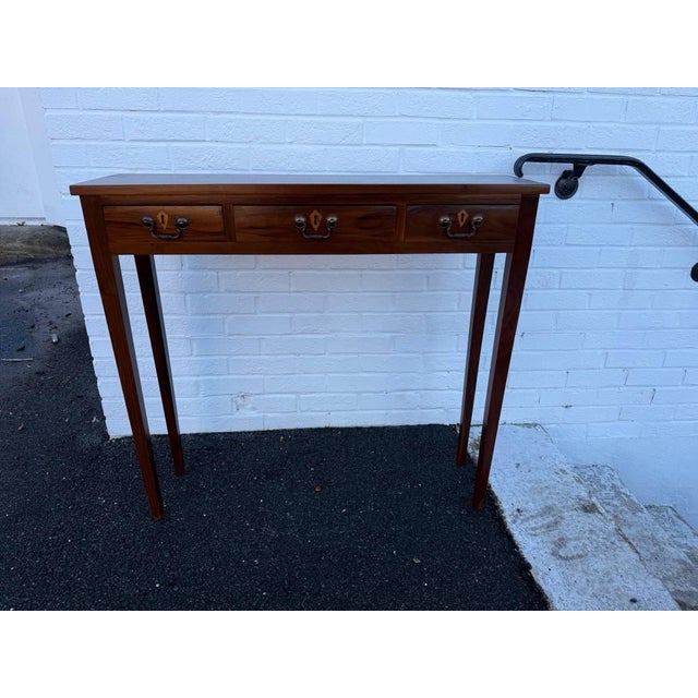 Custom Made Mahogany Hepplewhite Style 3 Drawer Console Table It features classic Hepplewhite styling with square tapered...