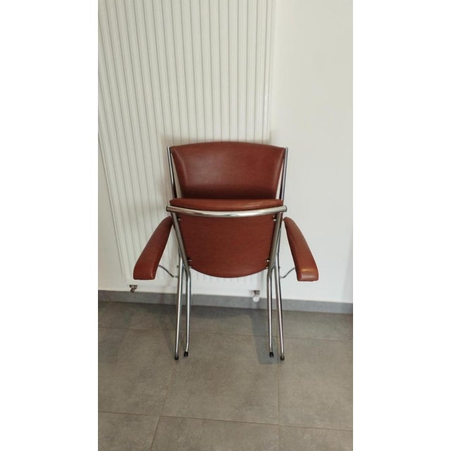 Folding armchair attributed to andré monpoix, a piece of modernist design a highly refined chrome-plated tubular metal...