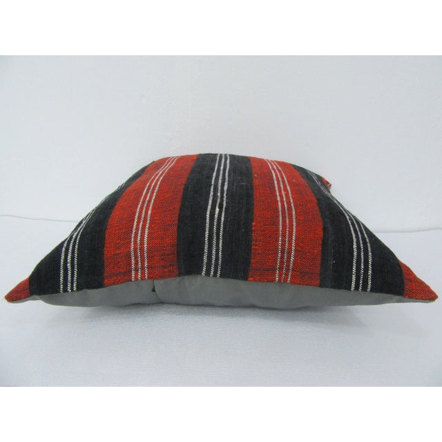 This is a pillow cover made from a vintage kilim rug. The piece was properly washed and ready to use. Pillow inserts not...