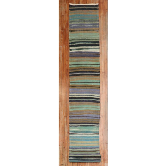 A One of a kind mid 20th century Turkish Kilim Runner with a striped motif Details rug no. r5395 size 2' 5" x 22' 6" (74 x...