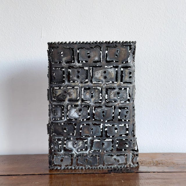 Vintage handmade torch cut metal luminary.