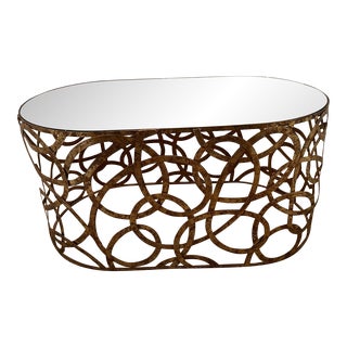 Oval Coffee Table With Mirrored Top & Brass Circle Motif Base For Sale