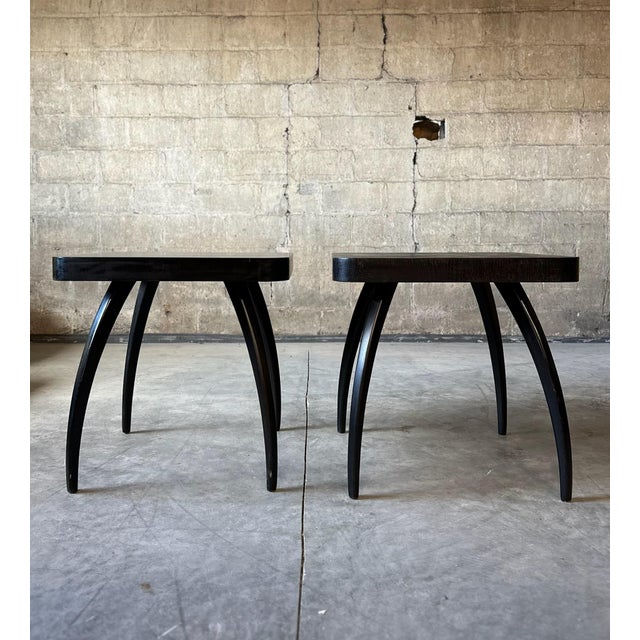 A pair of Jindrich Halabala 'Spider' side tables. Freshly lacquered in black. A classic with a refreshed look.