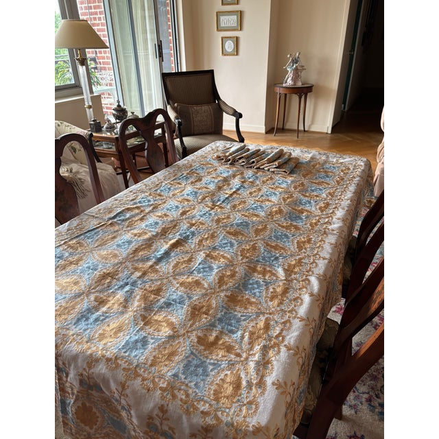 Bring a touch of MiddleEastern elegance to your dining experience with this authentic Syrian tablecloth with 8 matching...