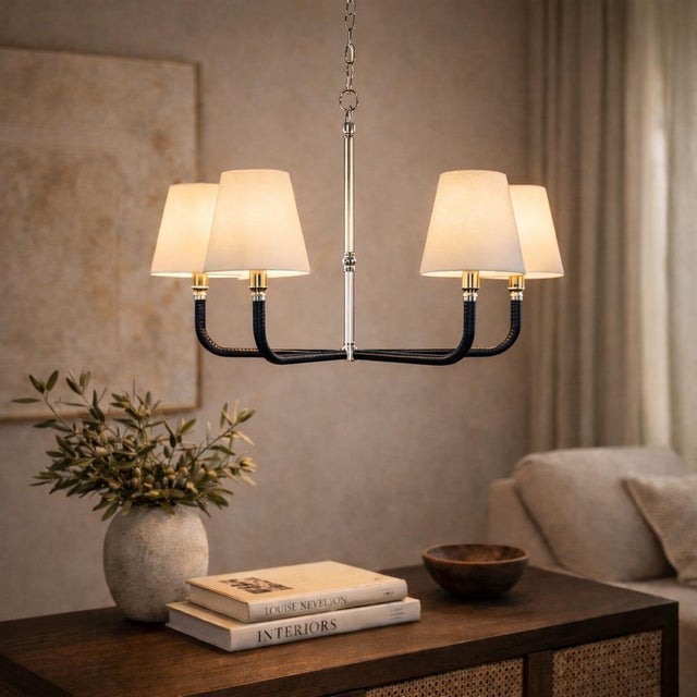 The Basden Medium Chandelier designed by Chapman & Myers for Visual Comfort Signature is a refined study in contrast —...