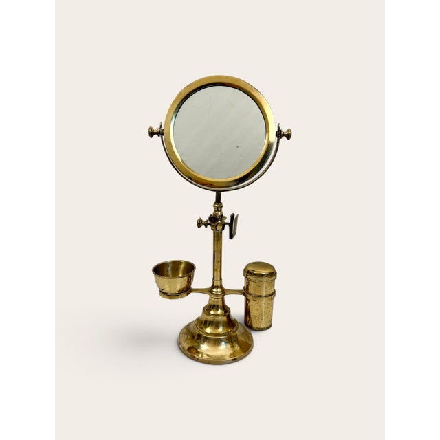 Very nice and hard to find antique vintage Brass Shaving Mirror with grooming stand. There is a double-sided mirror, one...