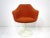 A special order upholstered non swiveling tulip arm chair with white back and base designed by Eero Saarinen . This...