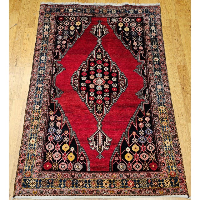 "Vintage Persian Mazgalan area rug, meticulously hand-knotted in the mid-1900s. Originating from the skilled weavers of...