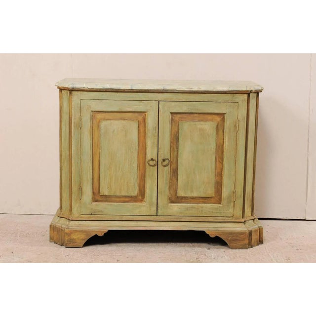 A custom American two-door painted wood buffet console. This vintage Italian style custom buffet cabinet has been...