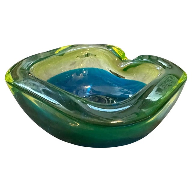 This stunning 1970s Murano glass ashtray, attributed to the Seguso manufactory, embodies the vibrant style of the mid-...