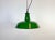 Industrial green enamel pendant light made by revo in united kingdom during the 1950s. White enamel inside the shade. Iron...