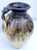 This versatile 9.5-inch hand-thrown ceramic studio pottery pitcher was created in 2012 by the contemporary Southern...