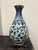 Lovely traditional blue and white vase featuring a bird in its design. Elegant form for any elevated space!