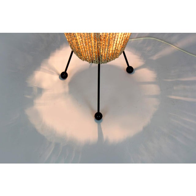 This floor lamp in the Space-Age style was manufactured in Czechoslovakia in the 1960s. The lamp stands on three steel...