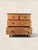 A charming late 19th century English pine chest of drawers featuring a classic two-over-two configuration and turned bun...