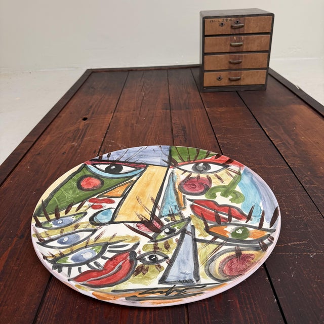 A large and expressive ceramic plate from seminara in calabria, made by gennaro condurso. a hand-painted and unique piece,...
