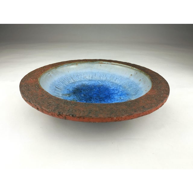 This beautiful bowl by Pieter Groeneveldt features a raw, unglazed surface on the exterior and rim, typical of...
