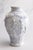 A lovely vintage Italian soft blue majolica vase decorated with frolicking cherubs or putti surrounded by draped floral...