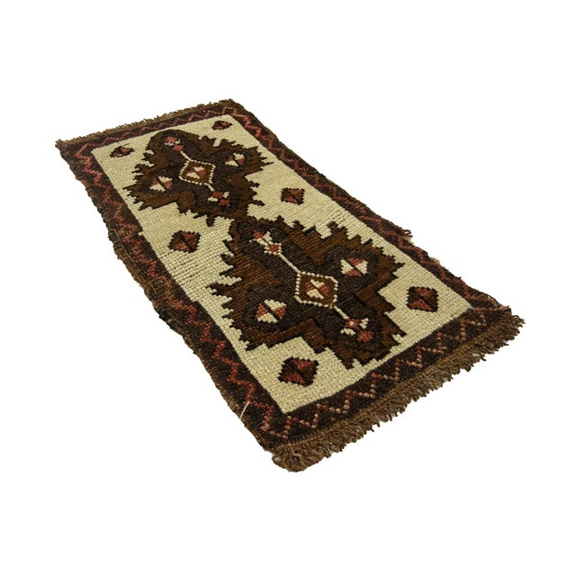 Vintage Handknotted decorative mini rug from Kars region of Turkey. Approximately 45-55 years old. In very good condition.