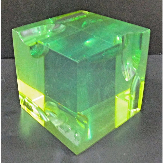 The Mid-Century Roz Stroll Optical Light and Space Sculpture is a small handmade piece made of Lucite, measuring 3 inches...
