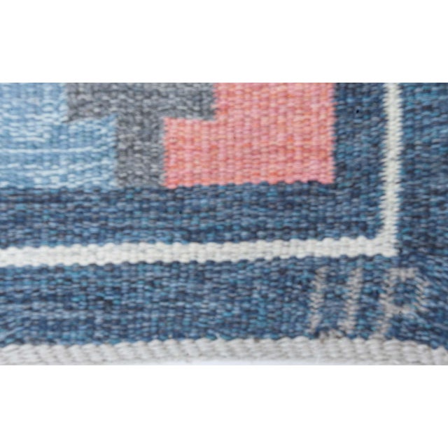 A striking example of mid-century Scandinavian textile artistry, this vintage flat-weave rug designed by Ulla Parkdahl is...