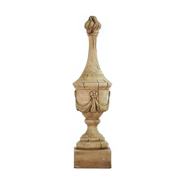 The Abel Urn from Zentique is a tall, slender poplar wood urn finial. The 24.5" height and narrow form create an...