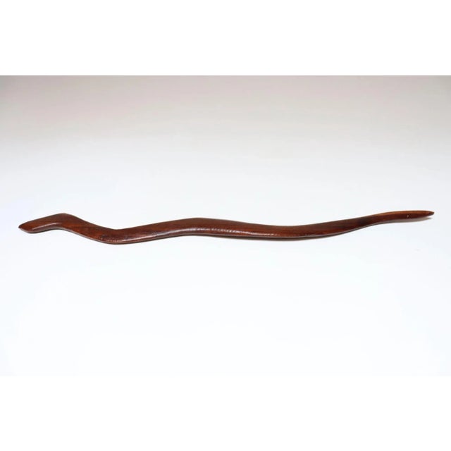 Folk Art hand-carved rosewood snake (ca. 1940s, USA). Attractive two-tone rosewood variations (rich brown tones throughout...