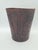 A decorative vintage basket/container made of embossed leather featuring a distinctive motif inspired by pre-columbian and...