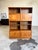 Mid century Danish teak two-piece shelving unit, featuring hidden and open shelving. Doors all slide smoothly. In...