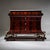Large Empire mahogany-veneered chest of drawers raised on an exceptionally crafted base supported by chimera figures with...