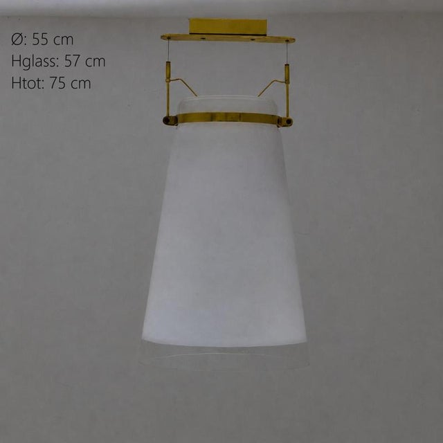 Ceiling lamp with large conical diffuser in white satin glass, completed in the lower part by a transparent glass band....