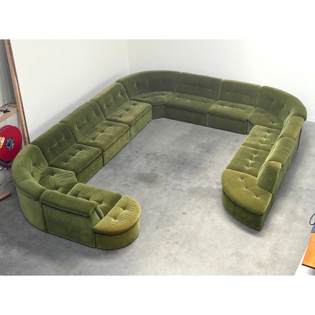 Very large mid century modular lounge sofa from the 1970s. 13 Elements upholstered in green fabric. All elements in very...