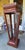 Unique leather wrapped pedestal or curio. Item features clear glass display case base with swing door, two interior glass...