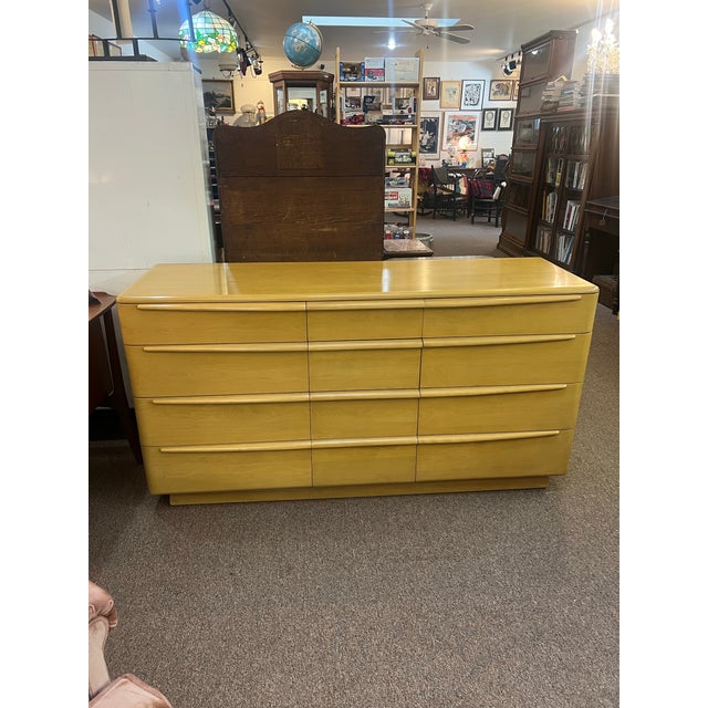 1958 Heywood Wakefield wheat 12 drawer dresser This is a rare find, good condition has wheels underneath it, except...