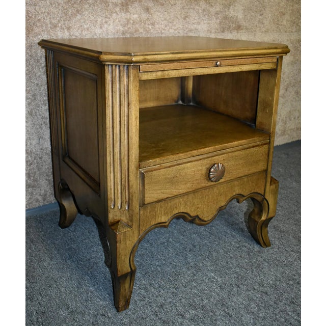 Vintage (1960s) Open Nightstand has a Mid Century Style. Made by John Stuart Furniture. The Chest is made of Wood. It has...