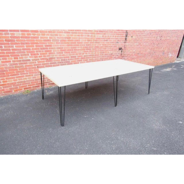 This 1970s vintage industrial hairpin leg table is handcrafted. Made with reclaimed wood from a basketball court. This...