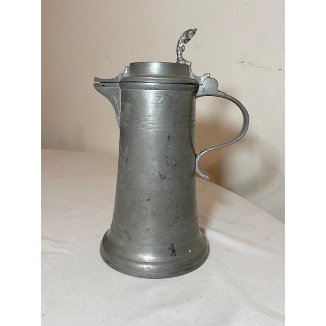 Up for sale is a rare antique early 19th century handmade pewter flagon pitcher. It's made out of thick pewter with a...