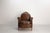 Club chair in patinated brown leather and skai seat cushion, circa 1920 a club chair dating from the 1920s, featuring a...