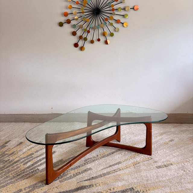 Stunning Adrian Pearsall attributed coffee table (could it be anyone else?) featuring a sculptural solid walnut base and...