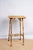 An antique bamboo occasional table with raffia top, c. 1890, English. Made in the Anglo-Japanese style of the Aesthetic...